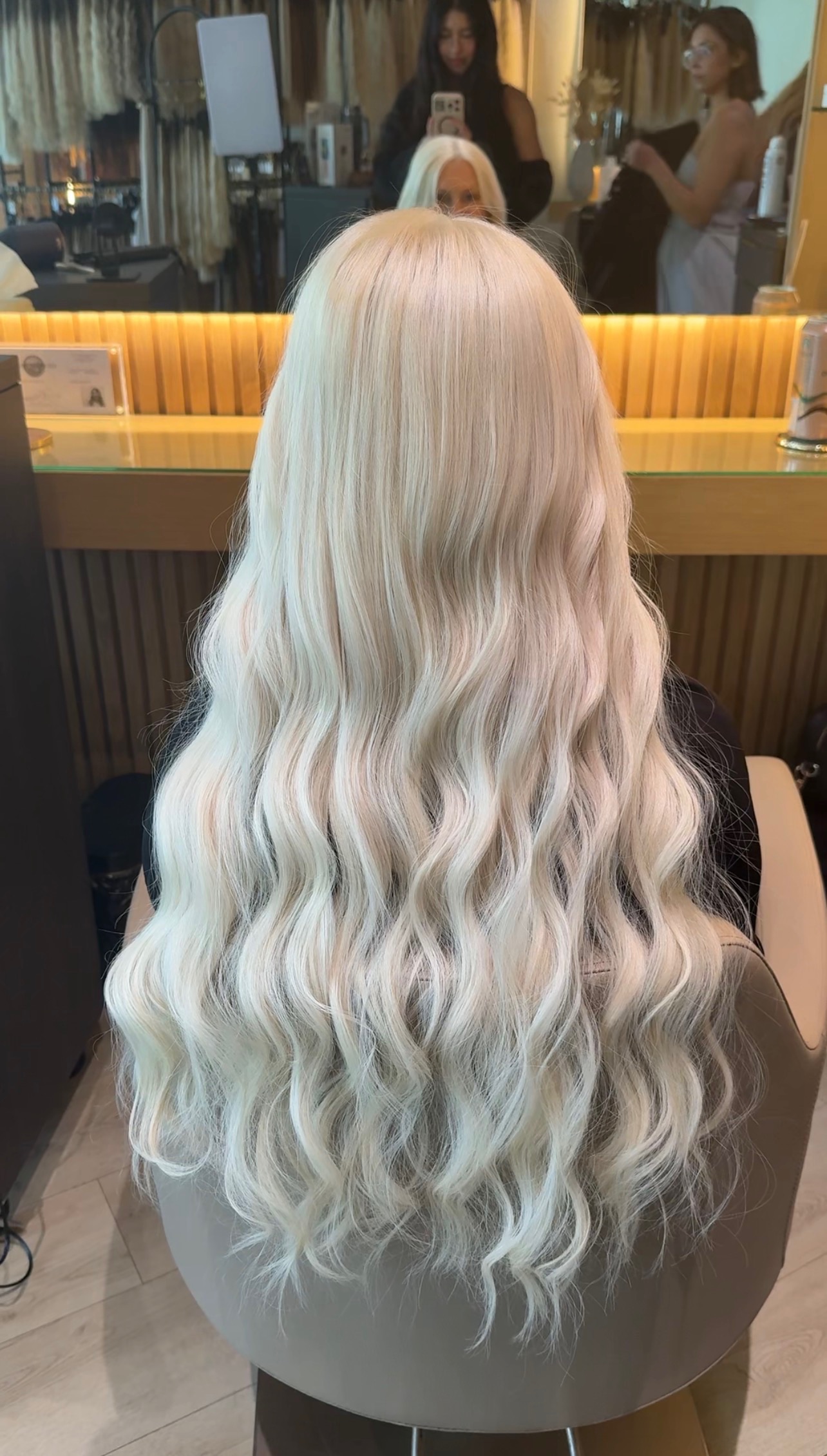 Long platinum hair extensions with soft waves